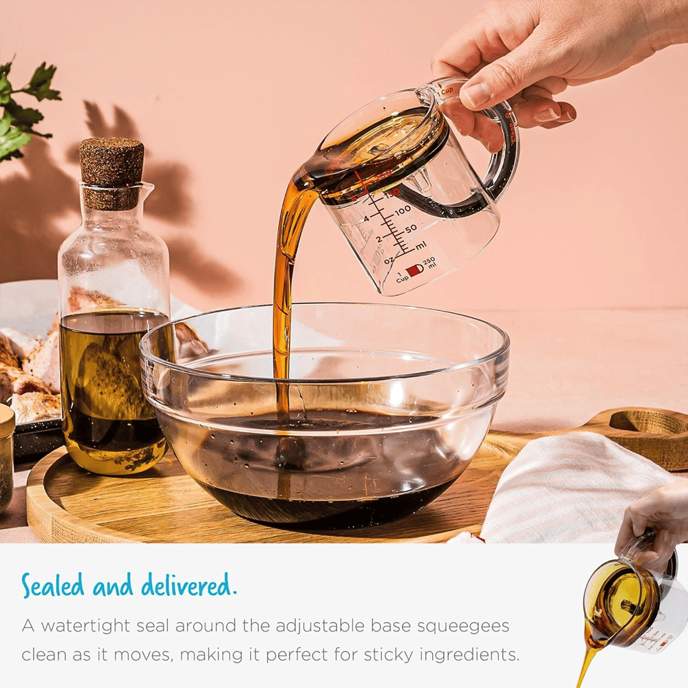 Measuring cup with adjustable base — 1 cup to ¼ cup in one