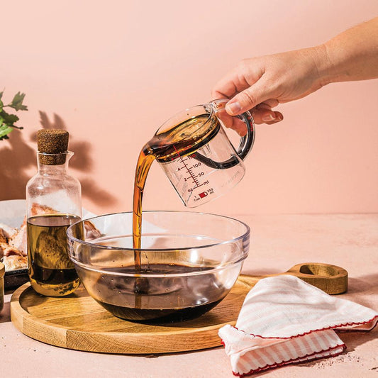 Measuring cup with adjustable base — 1 cup to ¼ cup in one