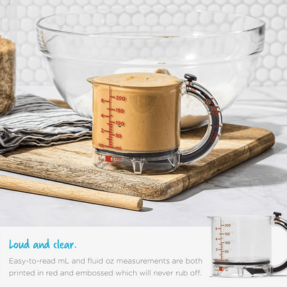 Measuring cup with adjustable base — 1 cup to ¼ cup in one